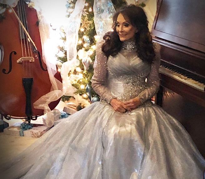 Loretta was photographed in 2019 wearing a gown designed by her close friend and dressmaker Tim Cobb.